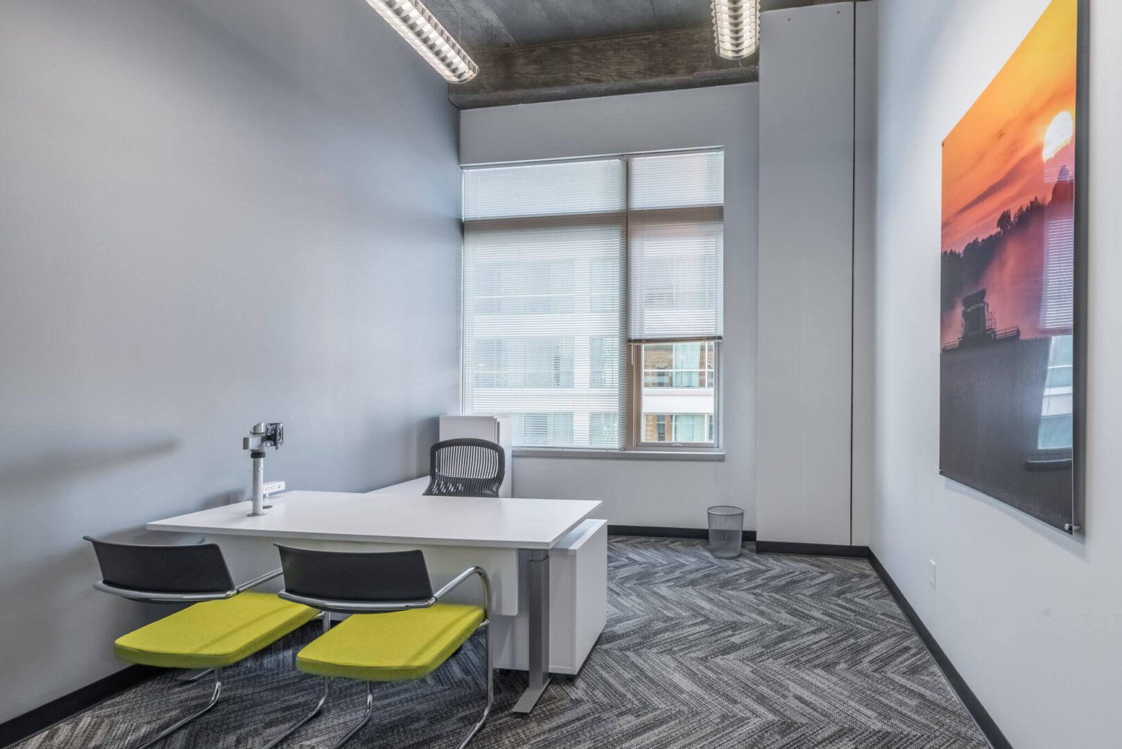 A room with two chairs and a desk