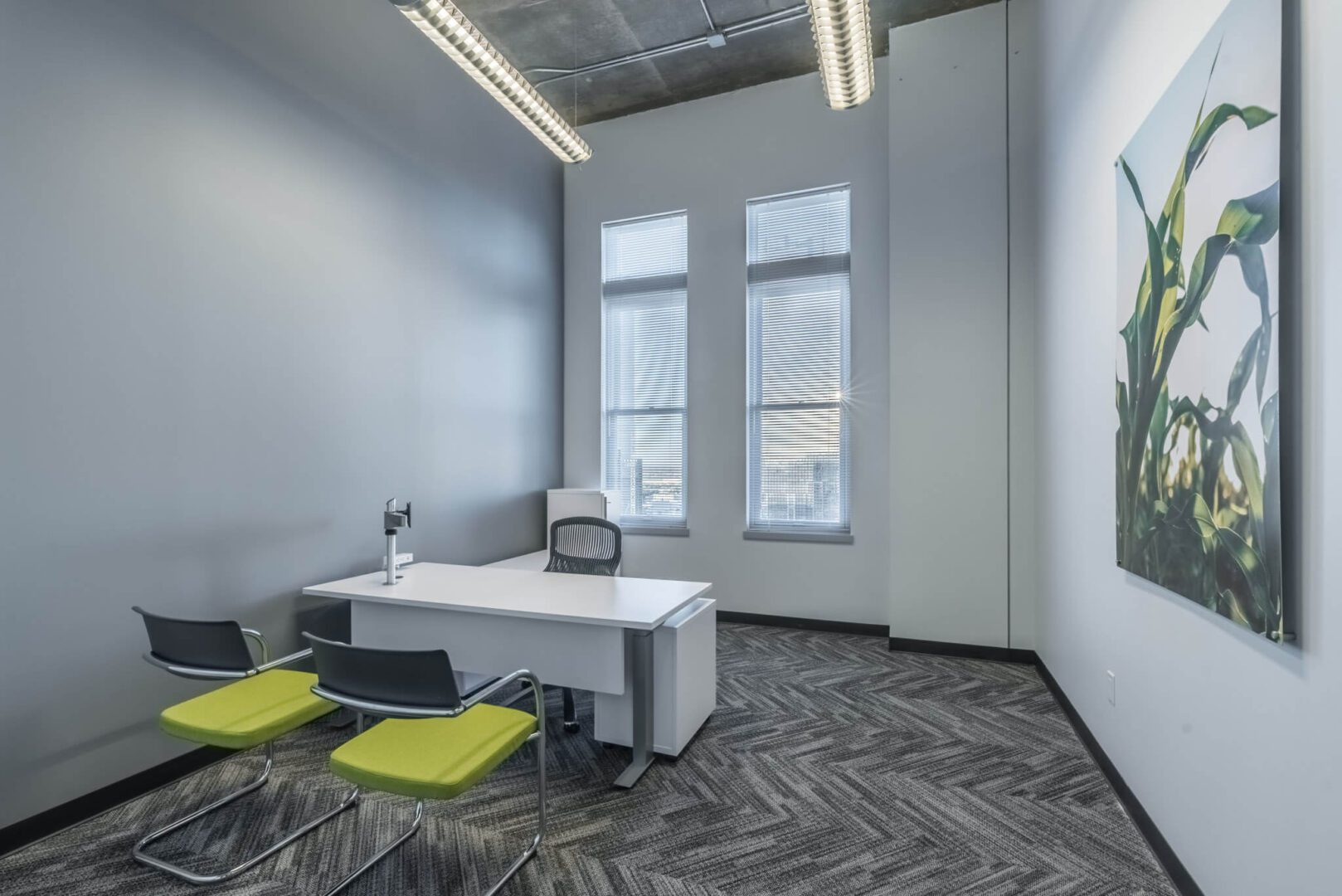 A room with two chairs and a desk