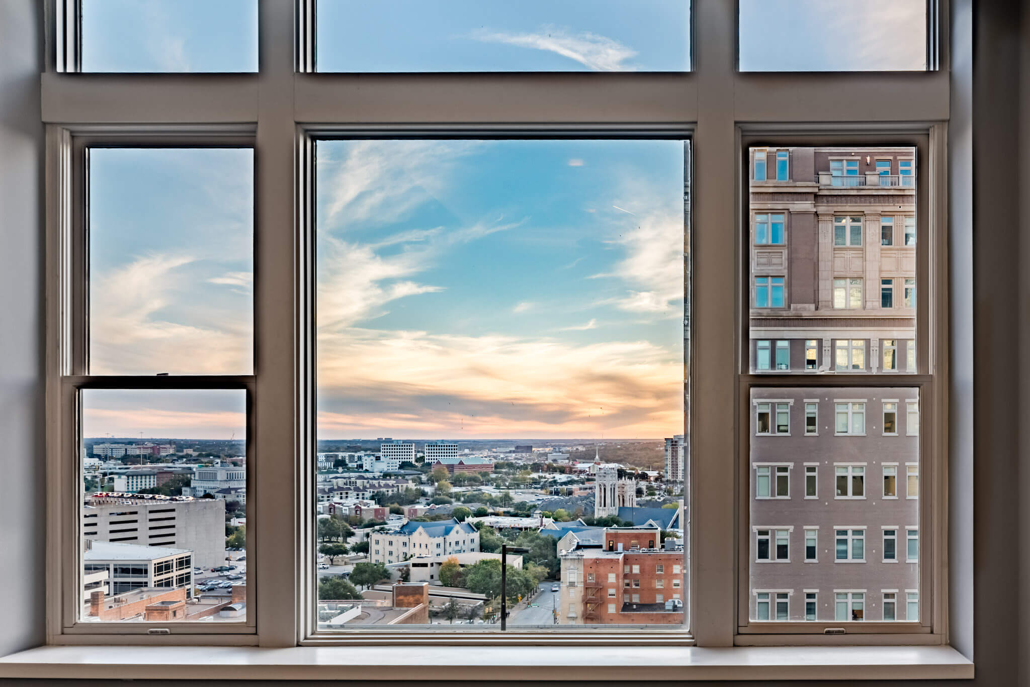 A window with a view of the city.