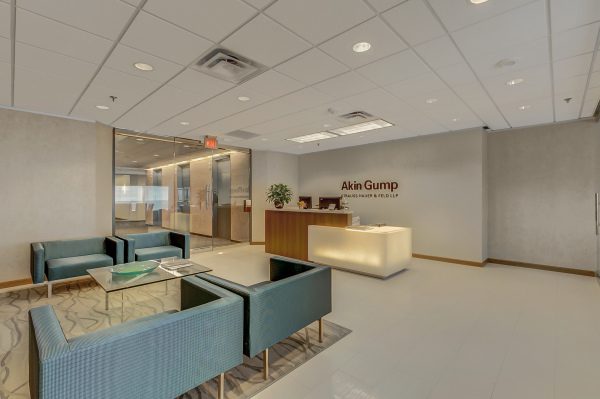 A lobby with couches and tables in it