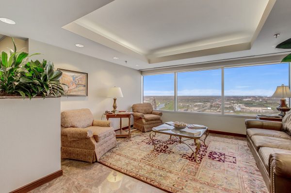 A living room with two chairs and a table